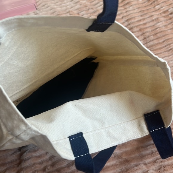 This is a tan and navy blue tote bag - Picture 2 of 2